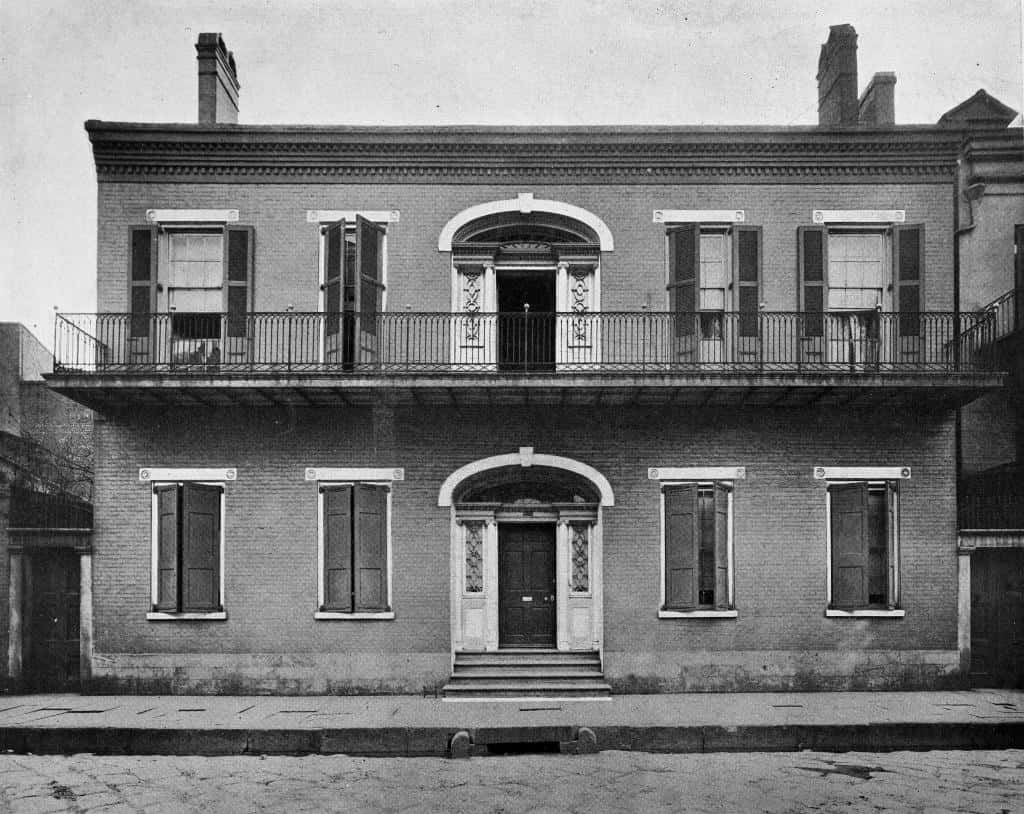 A historic photo of the Hermann-Grima House, located in New Orleans, Louisiana, and said to be haunted.