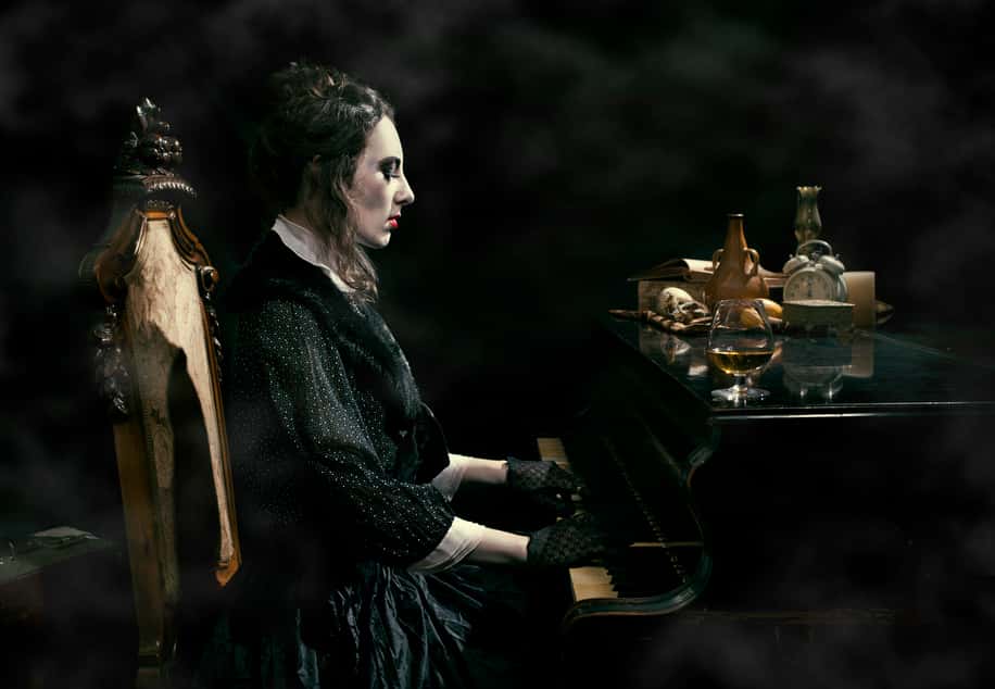 A Costumed Woman Playing Piano