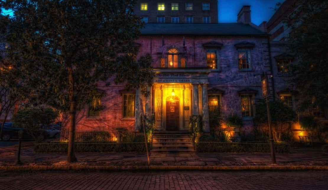 A photo of the Olde Pink House, which is located in Savannah, Georgia's historic district, and is believed to be haunted by the spirit of James Habersham, Jr.