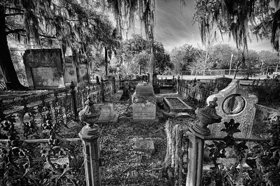 A photo of gravestones at the haunted Laurel Grove Cemetery in Savannah, Georgia.