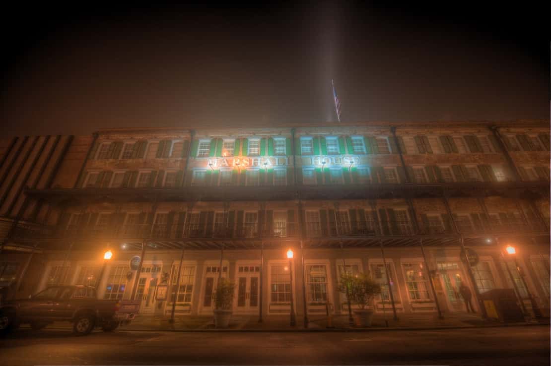 A photo of the Marshall House, otherwise known as the most haunted hotel in Savannah, Georgia, where the ghosts still roam the walls.