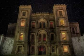 The Old Charleston Jail, photographed at night, rumored to be one of Charleston's most haunted places.