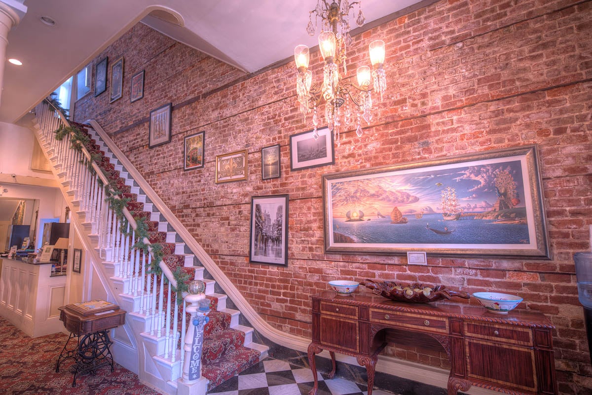 A photo of the interior stairwell at the haunted Lafitte's Guest House in New Orleans, Louisiana, Ghost City Tours.