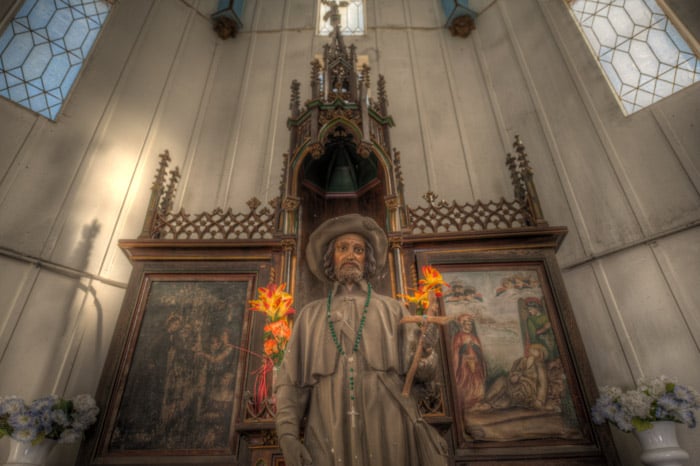 A photo of the St. Roch statue within St. Roch Cemetery No. 1, located in New Orleans, Louisiana.