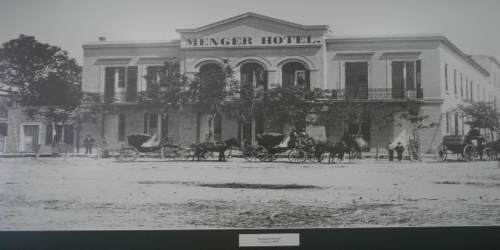 A historical photo of the Menger Hotel, located in San Antonio Texas, in 1865.