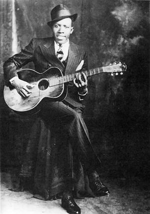 A historic photo of Robert Johnson, who was of America's most famous African American Blues Musicians.