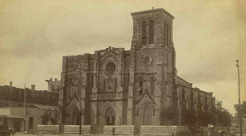 An historic photo of San Fernando Cathedral under renovation in 1873, which is located in San Antonio Texas